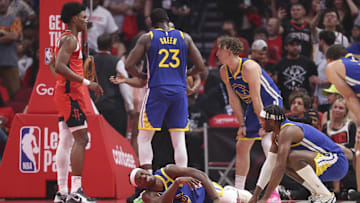 Apr 23, 2025; Houston, Texas, USA; Golden State Warriors forward Jimmy Butler III (10) suffers an apparent injury during the first quarter during game two of the first round for the 2024 NBA Playoffs against the Houston Rockets at Toyota Center. Mandatory Credit: Troy Taormina-Imagn Images