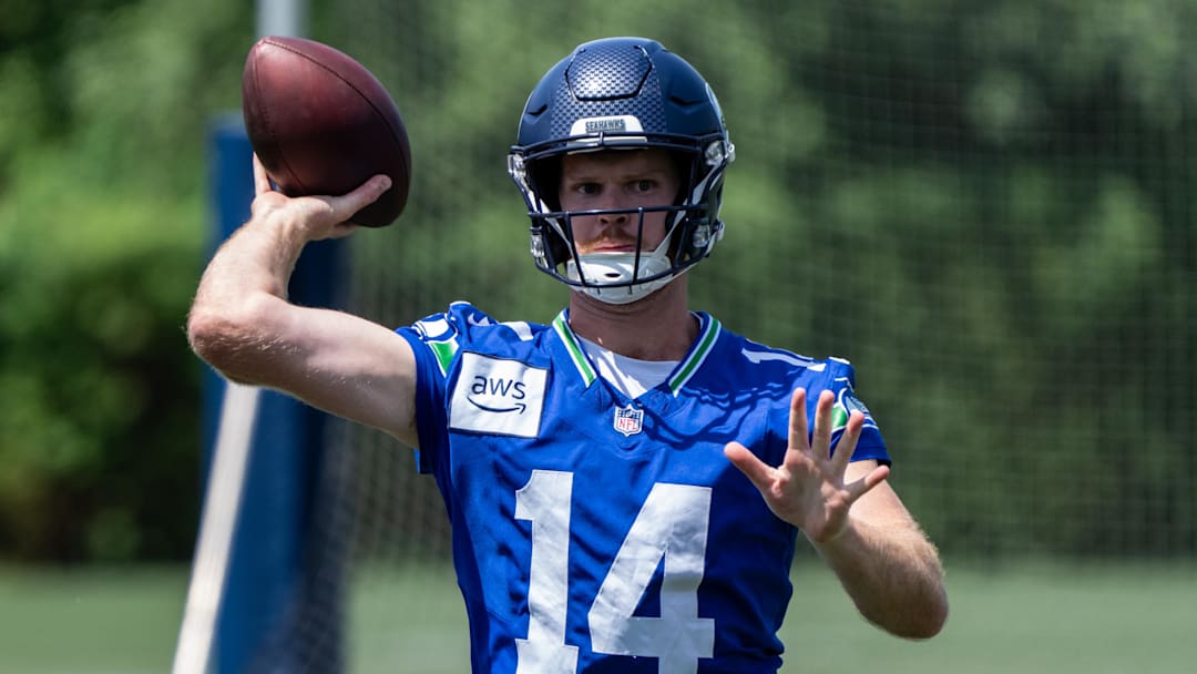 Jun 11, 2025; Renton, WA, USA; Seattle Seahawks quarterback Sam Darnold (14) passes the ball during mini-camp at Virginia Mason Athletic Center. Jun 11, 2025; Renton, WA, USA; Seattle Seahawks quarterback Sam Darnold (14) passes the ball during mini-camp at Virginia Mason Athletic Center.