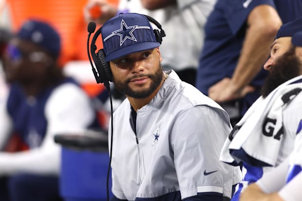 Dallas Cowboys quarterback Dak Prescott sits on the bench during the game against the Las Vegas Raiders.