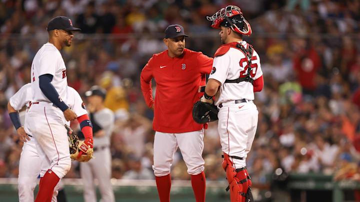Jul 9, 2022; Boston, Massachusetts, USA; Boston Red Sox manager Alex Cora (13) visits the mound during the sixth inning against the New York Yankees at Fenway Park. Mandatory Credit: Paul Rutherford-Imagn Images