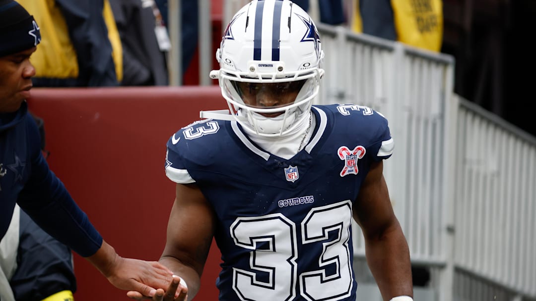 Dec 25, 2025; Landover, Maryland, USA; Dallas Cowboys running back Javonte Williams (33) runs onto the field for warmups before the game against the Washington Commanders at Northwest Stadium.