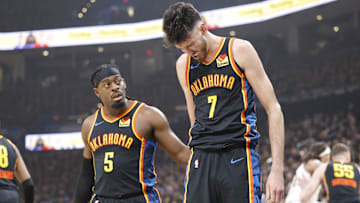 May 5, 2025; Oklahoma City, Oklahoma, USA; Oklahoma City Thunder guard Luguentz Dort (5) checks on forward Chet Holmgren (7) after he was hit during a play against the Denver Nuggets during the first quarter during game one of the second round for the 2025 NBA Playoffs at Paycom Center. Mandatory Credit: Alonzo Adams-Imagn Images