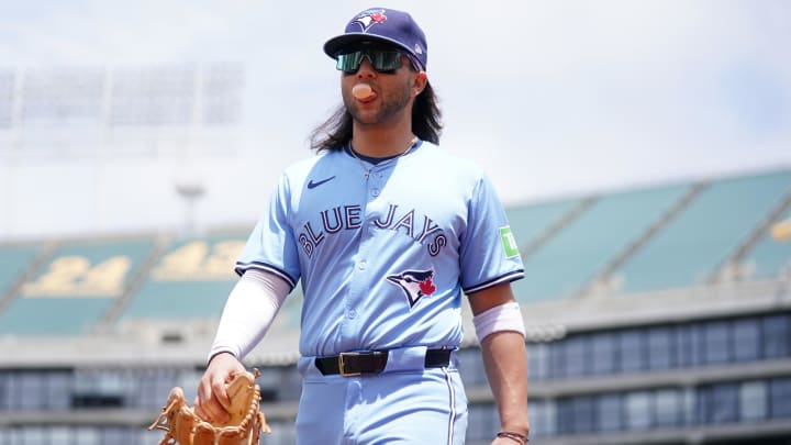 Jun 8, 2024; Oakland, California, USA; Toronto Blue Jays shortstop Bo Bichette (11) walks to the dugout before the start of the game against the Oakland Athletics at Oakland-Alameda County Coliseum.
