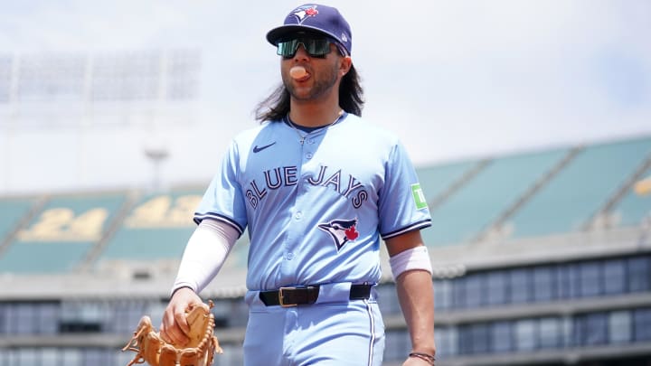 Jun 8, 2024; Oakland, California, USA; Toronto Blue Jays shortstop Bo Bichette (11) walks to the dugout before the start of the game against the Oakland Athletics at Oakland-Alameda County Coliseum. Mandatory Credit: Cary Edmondson-USA TODAY Sports