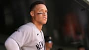 New York Yankees right fielder Aaron Judge (99) stands in the dugout against the Athletics in the seventh inning at Sutter Health Park.