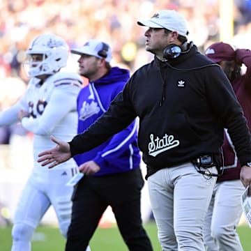Mississippi State Bulldogs head coach Jeff Lebby  reacts after a touchdown against the Mississippi Rebels at Vaught-Hemingway Stadium.