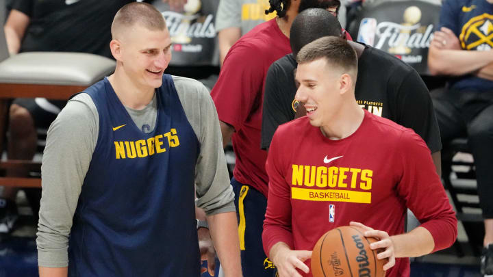 May 31, 2023; Denver, CO, USA; Denver Nuggets center Nikola Jokic (left) and forward Vlatko Cancar (right) smile during a practice session on media day before the 2023 NBA Finals at Ball Arena. Mandatory Credit: Kyle Terada-USA TODAY Sports