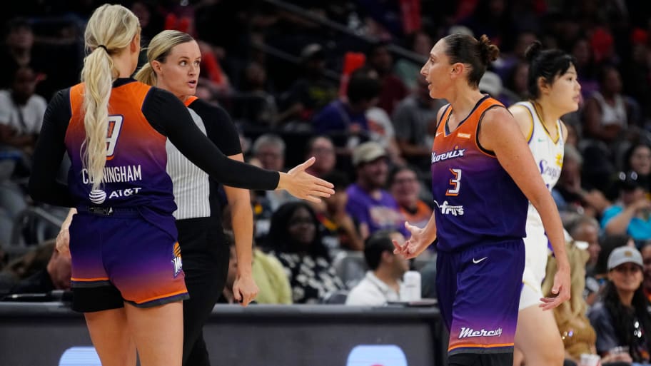 Phoenix Mercury players Diana Taurasi and Sophie Cunningham talk to an official in a game against the Sparks. 