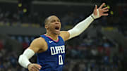  Apr 21, 2024; Los Angeles, California, USA; Los Angeles Clippers guard Russell Westbrook (0) celebrates after a dunk on a pass from guard James Harden (1) in the first half during game one of the first round for the 2024 NBA playoffs against the Dallas Mavericks at Crypto.com Arena. Mandatory Credit: Jayne Kamin-Oncea-Imagn Images