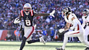 Nov 2, 2025; Foxborough, Massachusetts, USA;  New England Patriots wide receiver Stefon Diggs (8) runs for a touchdown against Atlanta Falcons safety Jessie Bates III (3) during the first half at Gillette Stadium. Mandatory Credit: Eric Canha-Imagn Images