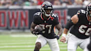 Sep 28, 2025; Houston, Texas, USA; Houston Texans running back Woody Marks (27) runs with the ball during the fourth quarter against the Tennessee Titans at NRG Stadium. Mandatory Credit: Troy Taormina-Imagn Images