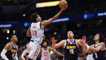 Dec 7, 2024; Washington, District of Columbia, USA; Washington Wizards guard Jordan Poole (13) shoots the ball as Denver Nuggets center Nikola Jokic (15) looks on in the third quarter at Capital One Arena. Mandatory Credit: Geoff Burke-Imagn Images