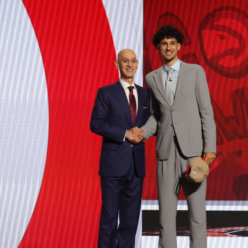 Jun 26, 2024; Brooklyn, NY, USA; Zaccharie Risacher poses for photos with NBA commissioner Adam Silver after being selected first overall by the Atlanta Hawks in the first round of the 2024 NBA Draft at Barclays Center. Mandatory Credit: Brad Penner-USA TODAY Sports