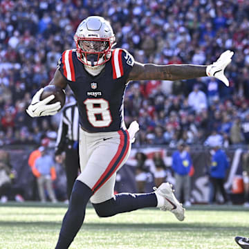 Nov 2, 2025; Foxborough, Massachusetts, USA;  New England Patriots wide receiver Stefon Diggs (8) runs for a touchdown against Atlanta Falcons safety Jessie Bates III (3) during the first half at Gillette Stadium. Mandatory Credit: Eric Canha-Imagn Images