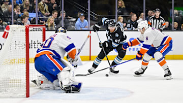 Jan 11, 2025; Salt Lake City, Utah, USA; Utah Hockey Club left wing Lawson Crouse (67) attempts a shot against New York Islanders goalie Marcus Hogberg (50) during second period at the Delta Center. Mandatory Credit: Christopher Creveling-Imagn Images