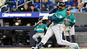 Oct 13, 2025; Toronto, Ontario, CAN; Seattle Mariners second baseman Jorge Polanco (7) hits a single against the Toronto Blue Jays in the seventh inning during game two of the ALCS round for the 2025 MLB playoffs at Rogers Centre. Mandatory Credit: Dan Hamilton-Imagn Images