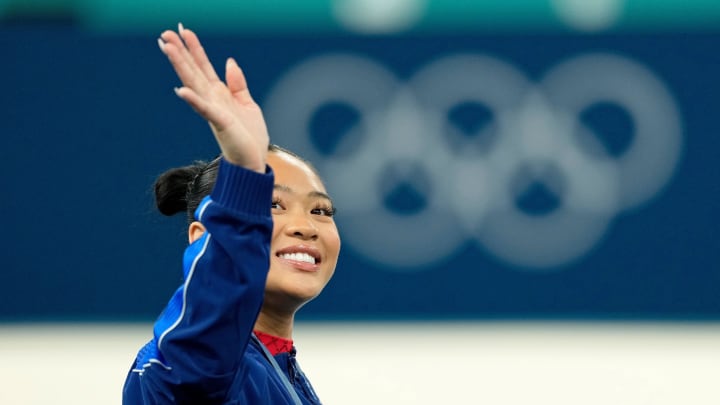 Aug 4, 2024; Paris, France; Sunisa Lee of the United States reacts after winning the bronze medal on uneven bars on the second day of gymnastics event finals during the Paris 2024 Olympic Summer Games at Bercy Arena. Mandatory Credit: Kyle Terada-USA TODAY Sports