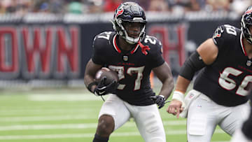 Sep 28, 2025; Houston, Texas, USA; Houston Texans running back Woody Marks (27) runs with the ball during the fourth quarter against the Tennessee Titans at NRG Stadium. Mandatory Credit: Troy Taormina-Imagn Images