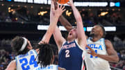 Mar 23, 2023; Las Vegas, NV, USA; Gonzaga Bulldogs forward Drew Timme (2) reaches for a loose ball against UCLA Bruins guard Jaime Jaquez Jr. (24) and forward Kenneth Nwuba (14) during the first half at T-Mobile Arena. Mandatory Credit: Joe Camporeale-USA TODAY Sports