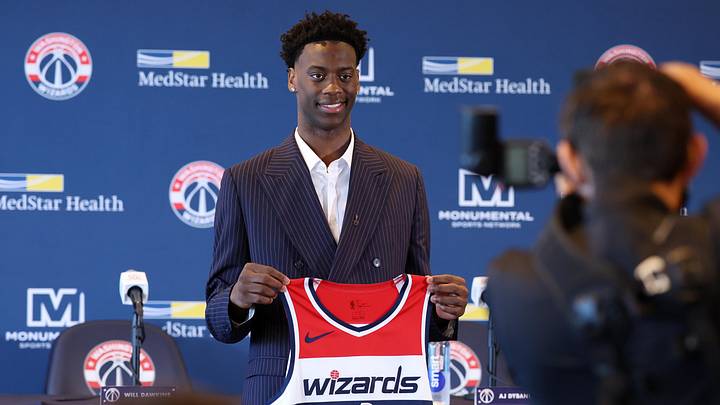 Jun 25, 2026; Washington, DC, USA; Washington Wizards first round draft pick and number one overall pick AJ Dybantsa poses for a photo with his jersey during a press conference at InterContinental Hotel. Mandatory Credit: Amber Searls-Imagn Images