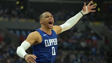  Apr 21, 2024; Los Angeles, California, USA; Los Angeles Clippers guard Russell Westbrook (0) celebrates after a dunk on a pass from guard James Harden (1) in the first half during game one of the first round for the 2024 NBA playoffs against the Dallas Mavericks at Crypto.com Arena. Mandatory Credit: Jayne Kamin-Oncea-USA TODAY Sports