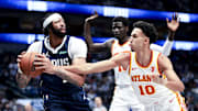 Apr 2, 2025; Dallas, Texas, USA;  Dallas Mavericks forward Anthony Davis (3) looks to pass around Atlanta Hawks forward Zaccharie Risacher (10) during the third quarter at American Airlines Center. Mandatory Credit: Kevin Jairaj-Imagn Images