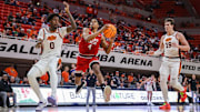Feb 15, 2025; Stillwater, Oklahoma, USA; Texas Tech Red Raiders guard Christian Anderson (4) drives to the basket around Oklahoma State Cowboys forward Marchelus Avery (0) during the second half at Gallagher-Iba Arena. Mandatory Credit: William Purnell-Imagn Images