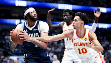 Apr 2, 2025; Dallas, Texas, USA;  Dallas Mavericks forward Anthony Davis (3) looks to pass around Atlanta Hawks forward Zaccharie Risacher (10) during the third quarter at American Airlines Center. Mandatory Credit: Kevin Jairaj-Imagn Images