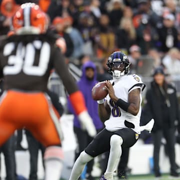 Nov 16, 2025; Cleveland, Ohio, USA; Baltimore Ravens quarterback Lamar Jackson (8) throws downfield during the first quarter during the first quarter against the Cleveland Browns at Huntington Bank Field. Mandatory Credit: Scott Galvin-Imagn Images