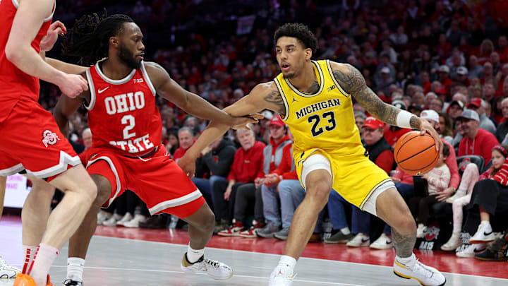 Feb 8, 2026; Columbus, Ohio, USA;  Michigan Wolverines forward Yaxel Lendeborg (23) sets the play as Ohio State Buckeyes guard Bruce Thornton (2) defends during the first half at Value City Arena. Mandatory Credit: Joseph Maiorana-Imagn Images