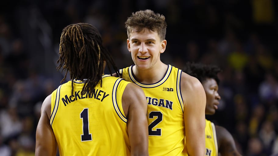 Michigan forward Will Tschetter and guard Trey McKenney celebrate during a recent game.