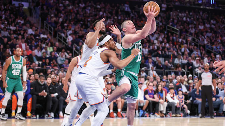 May 10, 2025; New York, New York, USA; Boston Celtics guard Payton Pritchard (11) drives past New York Knicks guard Miles McBride (2) in the third quarter during game three of the second round for the 2025 NBA Playoffs at Madison Square Garden. Mandatory Credit: Wendell Cruz-Imagn Images
