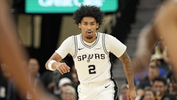 Oct 30, 2025; San Antonio, Texas, USA; San Antonio Spurs guard Dylan Harper (2) gets back on defense during the first half against the Miami Heat at Frost Bank Center. Mandatory Credit: Scott Wachter-Imagn Images