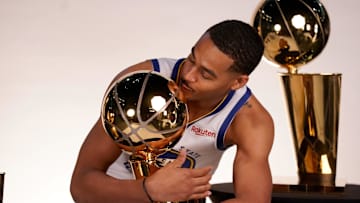 Sep 25, 2022; San Francisco, CA, USA; Golden State Warriors guard Jordan Poole (3) poses with the Larry O'Brien Championship Trophies during Media Day at the Chase Center. Mandatory Credit: Cary Edmondson-Imagn Images