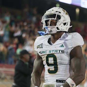 Sep 16, 2023; Stanford, California, USA; Sacramento State Hornets running back Marcus Fulcher (9) is celebrating after scoring a touchdown during the fourth quarter against the Stanford Cardinal at Stanford Stadium. Mandatory Credit: Sergio Estrada-Imagn Images