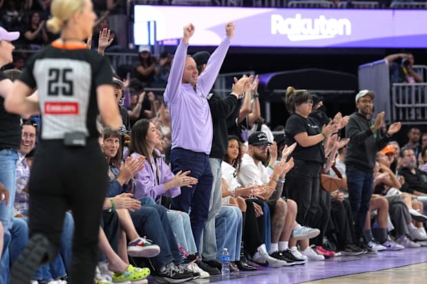 Golden State Valkyries co-owner Joe Lacob stands and cheers. 