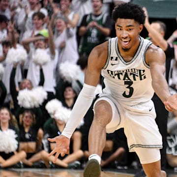 Nov 19, 2024; East Lansing, Michigan, USA;  Michigan State Spartans guard Jaden Akins (3) celebrates a three point shot during the first half against the Samford Bulldogs at Jack Breslin Student Events Center. Mandatory Credit: Dale Young-Imagn Images