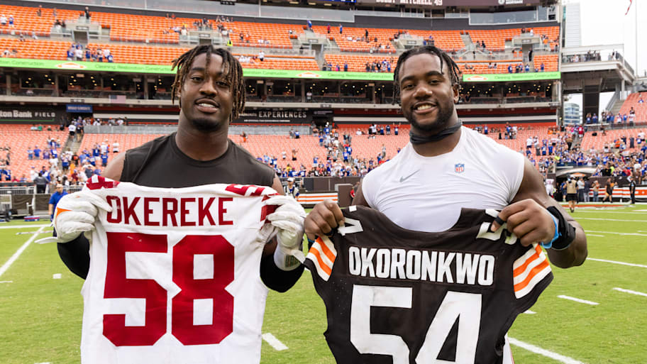 Ogbo Okoronkwo (left) poses with Bobby Okereke after a game between the Browns and Giants. | Scott Galvin-Imagn Images