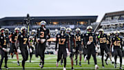 Nov 22, 2025; Nashville, Tennessee, USA;  Vanderbilt Commodores cornerback Kolbey Taylor (3) celebrates with his teammates after the interception against the Kentucky Wildcats during the first half at FirstBank Stadium. Mandatory Credit: Steve Roberts-Imagn Images
