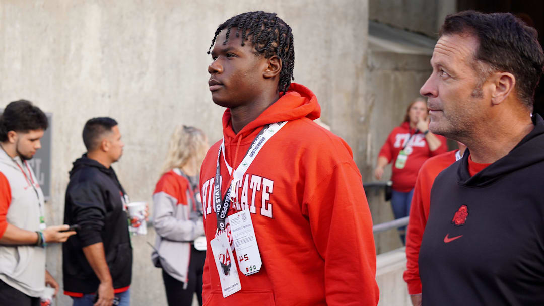 Ransom Everglades quarterback Neimann Lawrence walks into Ohio Stadium before the Buckeyes' 56-0 win over Western Michigan.