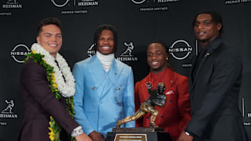 Dec 14, 2024; New York, NY, USA; From left, Heisman Trophy nominees Oregon Ducks quarterback Dillon Gabriel, Colorado Buffaloes wide receiver/cornerback Travis Hunter, Boise State Broncos running back Ashton Jeanty and Miami Hurricanes quarterback Cam Ward pose for a photo during a press conference before the 2024 Heisman Trophy Presentation.