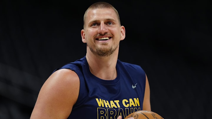 Apr 11, 2025; Denver, Colorado, USA; Denver Nuggets center Nikola Jokic (15) reacts before the game against the Memphis Grizzlies at Ball Arena. Mandatory Credit: Ron Chenoy-Imagn Images