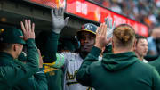 Jul 30, 2024; San Francisco, California, USA;  Oakland Athletics right fielder Lawrence Butler (4) is congratulated by teammates after hitting a solo homer against the San Francisco Giants during the third inning at Oracle Park.