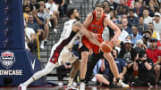 Jul 10, 2024; Las Vegas, Nevada, USA; USA forward Jayson Tatum (10) knocks the ball away from Canada forward Kelly Olynyk (13) in the first quarter during the USA Basketball Showcase at T-Mobile Arena. Mandatory Credit: Candice Ward-USA TODAY Sports