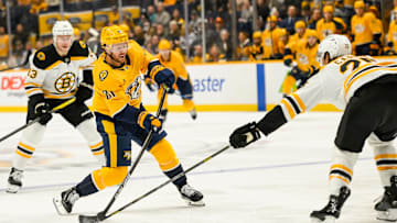 Oct 22, 2024; Nashville, Tennessee, USA;  Boston Bruins defenseman Brandon Carlo (25) blocks the shot of Nashville Predators center Jonathan Marchessault (81) during the first period at Bridgestone Arena. Mandatory Credit: Steve Roberts-Imagn Images