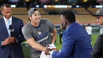 Oct 20, 2024; Los Angeles, California, USA; Los Angeles Dodgers designated hitter Shohei Ohtani (17) and David Ortiz shake hands in an interview after the Los Angeles Dodgers defeated the New York Mets in game six of the NLCS to advance to the World Series in the 2024 MLB playoffs at Dodger Stadium. Mandatory Credit: Kiyoshi Mio-Imagn Images