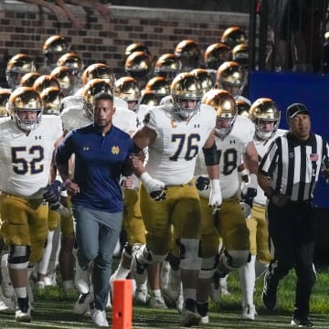 Sep 30, 2023; Durham, North Carolina, USA; Notre Dame Fighting Irish head coach Marcus Freeman leads his team onto the field during the first quarter against the Duke Blue Devils at Wallace Wade Stadium.  