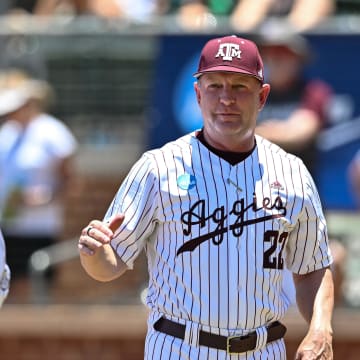 Jun 8, 2024; College Station, TX, USA; Texas A&M head coach Jim Schlossnagle greets players during introductions prior to the game against the Oregon at Olsen Field, Blue Bell Park Mandatory Credit: Maria Lysaker-USA TODAY Sports