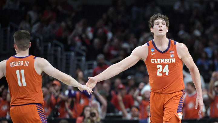 Mar 28, 2024; Los Angeles, CA, USA; Clemson Tigers center PJ Hall (24) and guard Joseph Girard III (11) react in the first half against the Arizona Wildcats in the semifinals of the West Regional of the 2024 NCAA Tournament at Crypto.com Arena. Mandatory Credit: Jayne Kamin-Oncea-USA TODAY Sports