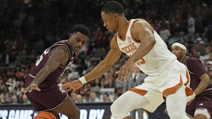 Jan 25, 2025; Austin, Texas, USA; Texas Longhorns forward Jayson Kent (25) and Texas A&M Aggies guard George Turkson Jr. (5) reach for the loose ball during the first half at Moody Center. Mandatory Credit: Scott Wachter-Imagn Images Jan 25, 2025; Austin, Texas, USA; Texas Longhorns forward Jayson Kent (25) and Texas A&M Aggies guard George Turkson Jr. (5) reach for the loose ball during the first half at Moody Center. Mandatory Credit: Scott Wachter-Imagn Images